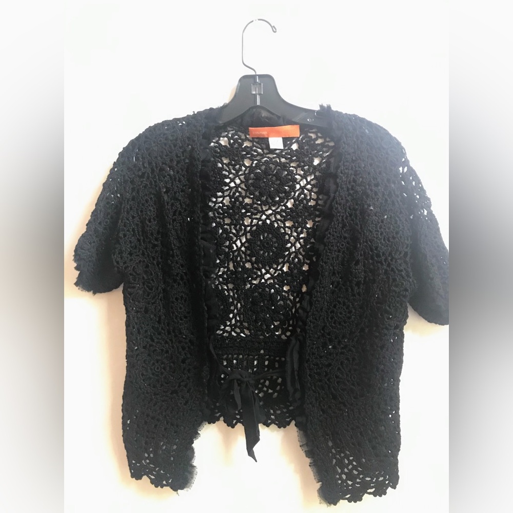 Black crochet jacket with chiffon trim by Cynthia Steffe.